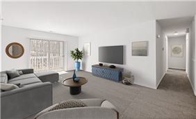 Spacious Living Room with Sliding Glass Doors Leading to Private Balcony