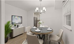 Luxury Vinyl Plank Flooring in Dining and Kitchen Area (Two-Bedroom Layout with Model Furniture Shown)